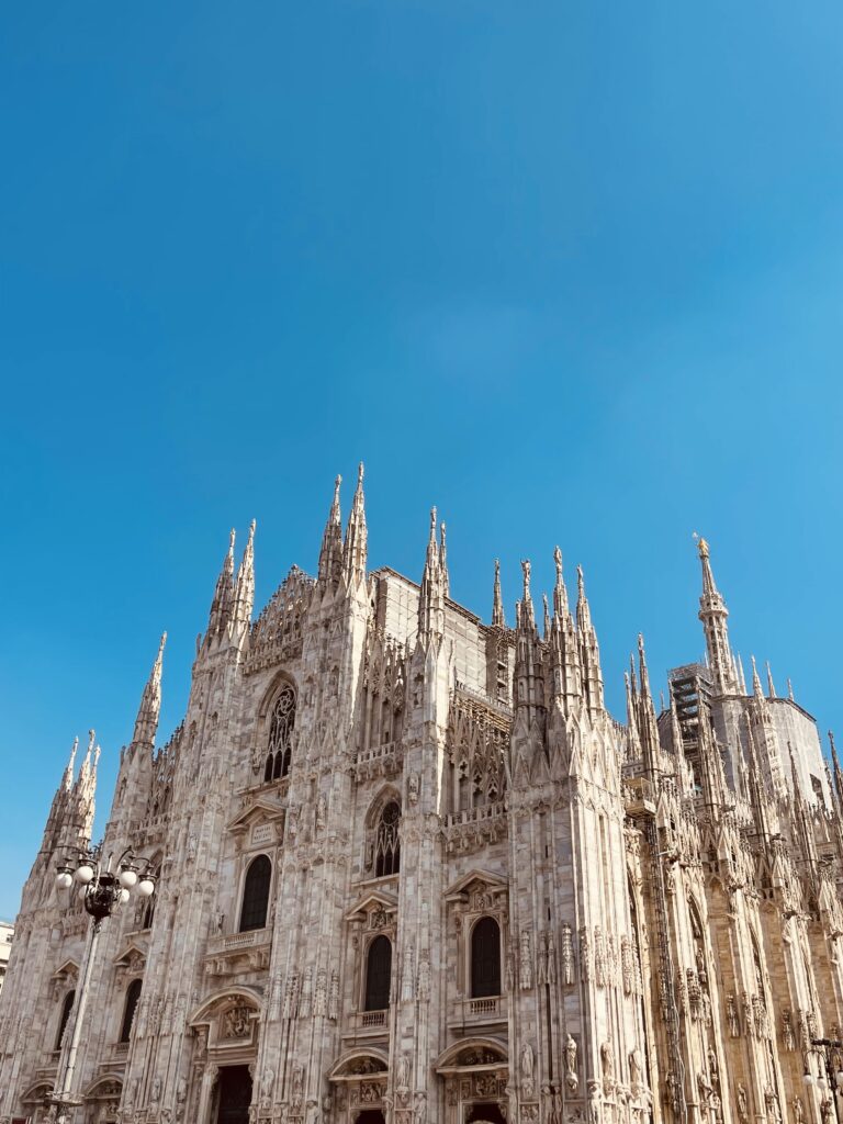 A detailed view of the magnificent gothic spires of the Duomo di Milano, a featured landmark in a bespoke European itinerary by Travellé.